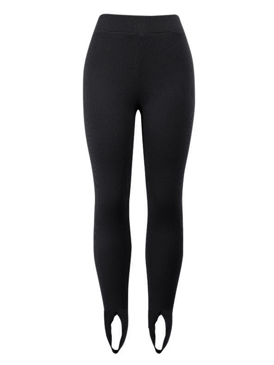 Black ribbed knit stirrup leggings with a high waist.