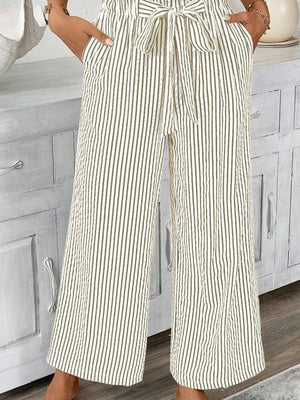 Maternity paper bag waist pants in army green and white stripe, with a tie belt and wide leg.