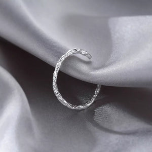 Gray ring featuring textured and textured