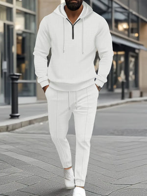 White textured quarter-zip hoodie and matching joggers set for men.