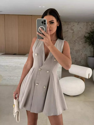 Gray double-breasted mini dress with V-neck, sleeveless, and pleated skirt.