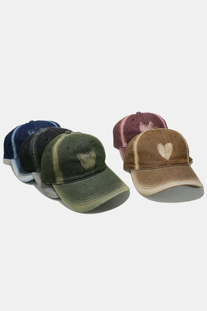 Bleached heart baseball cap in moss and caramel colors, with a faded effect.