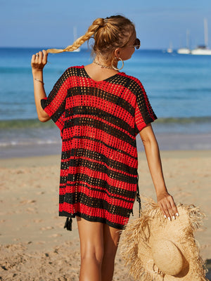 Red and black striped crochet beach cover-up with drawstring sides and tassel hem.