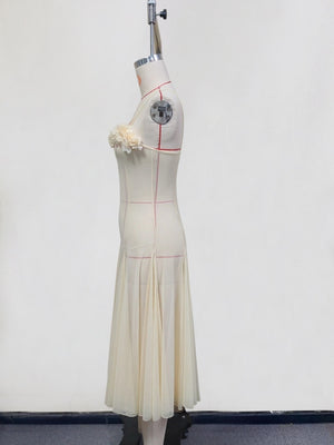 Cream chiffon maxi dress with floral bust detail and pleated skirt