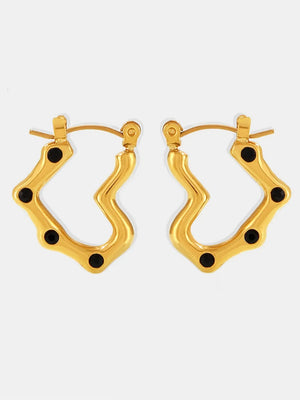 Gold wave hoop earrings with black accents