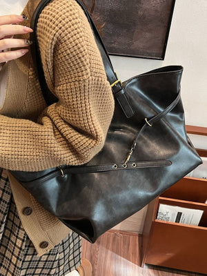 tote in dark gray with adjustable straps and large