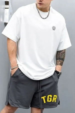 White oversized t-shirt with minimalist chest emblem and crew neck