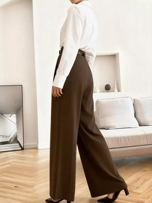 High-waisted brown pleated wide leg maternity trousers with a relaxed fit.