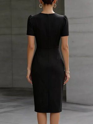 Black midi dress with ruched waist, short sleeves, and a back zipper.