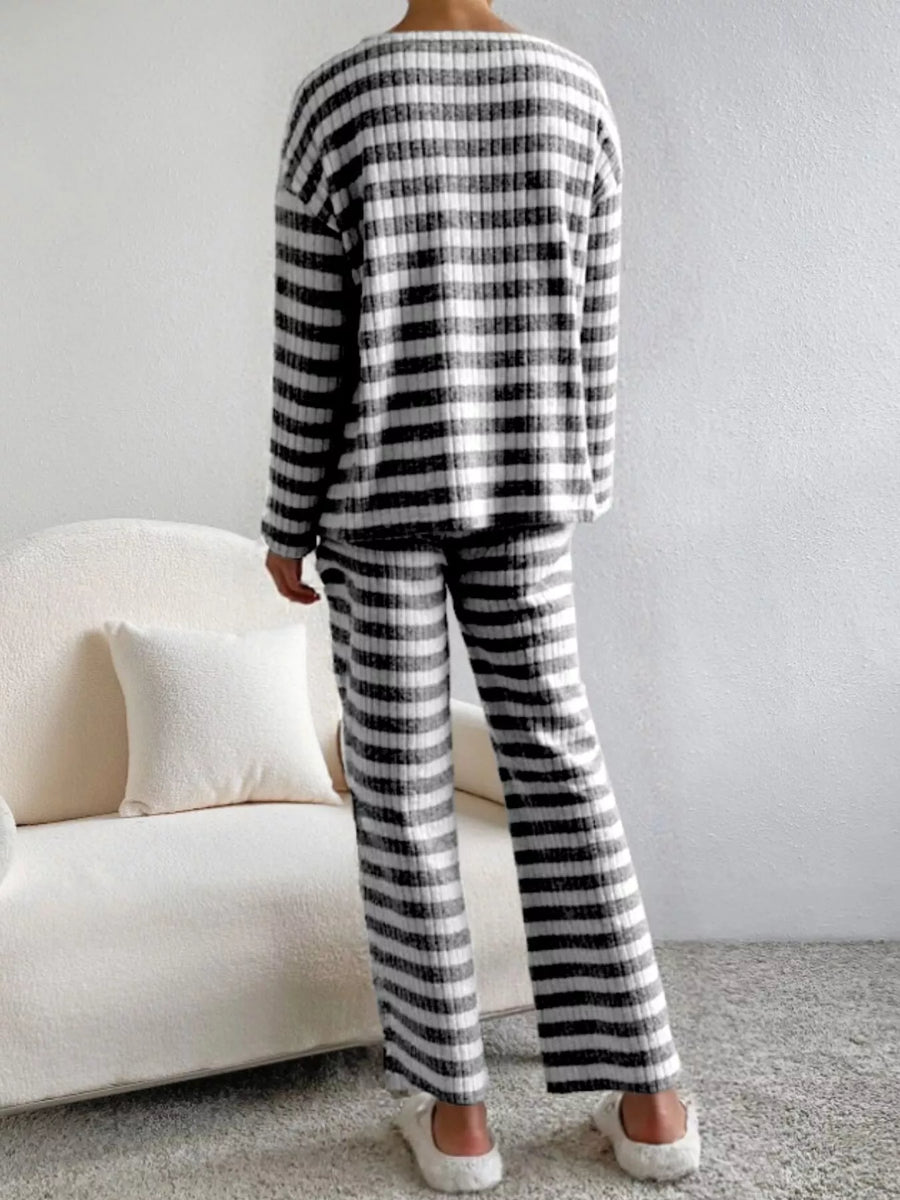 Black striped knit loungewear set with long sleeves and pants.
