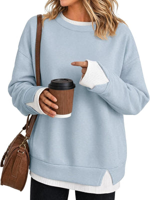sweatshirt in light blue featuring contrast ribbed trim and relaxed fit