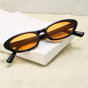 PC Frame material: Polycarbonate Lens material: Polycarbonate Temple material: P sunglasses in amber orange with oval