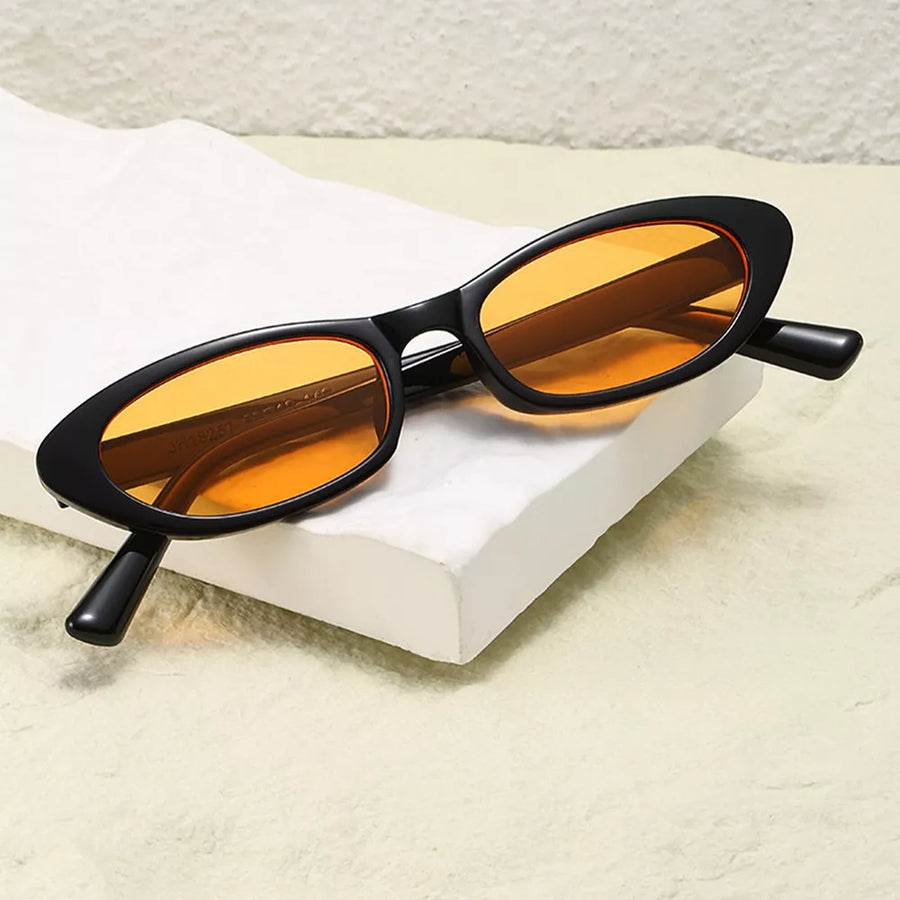 PC Frame material: Polycarbonate Lens material: Polycarbonate Temple material: P sunglasses in amber orange with oval