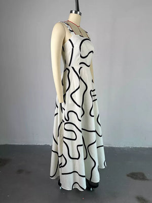 White abstract patterned midi dress with square neck and thin straps.