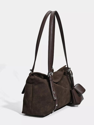 Brown suede medium shoulder bag with adjustable straps and a small attached pouch.