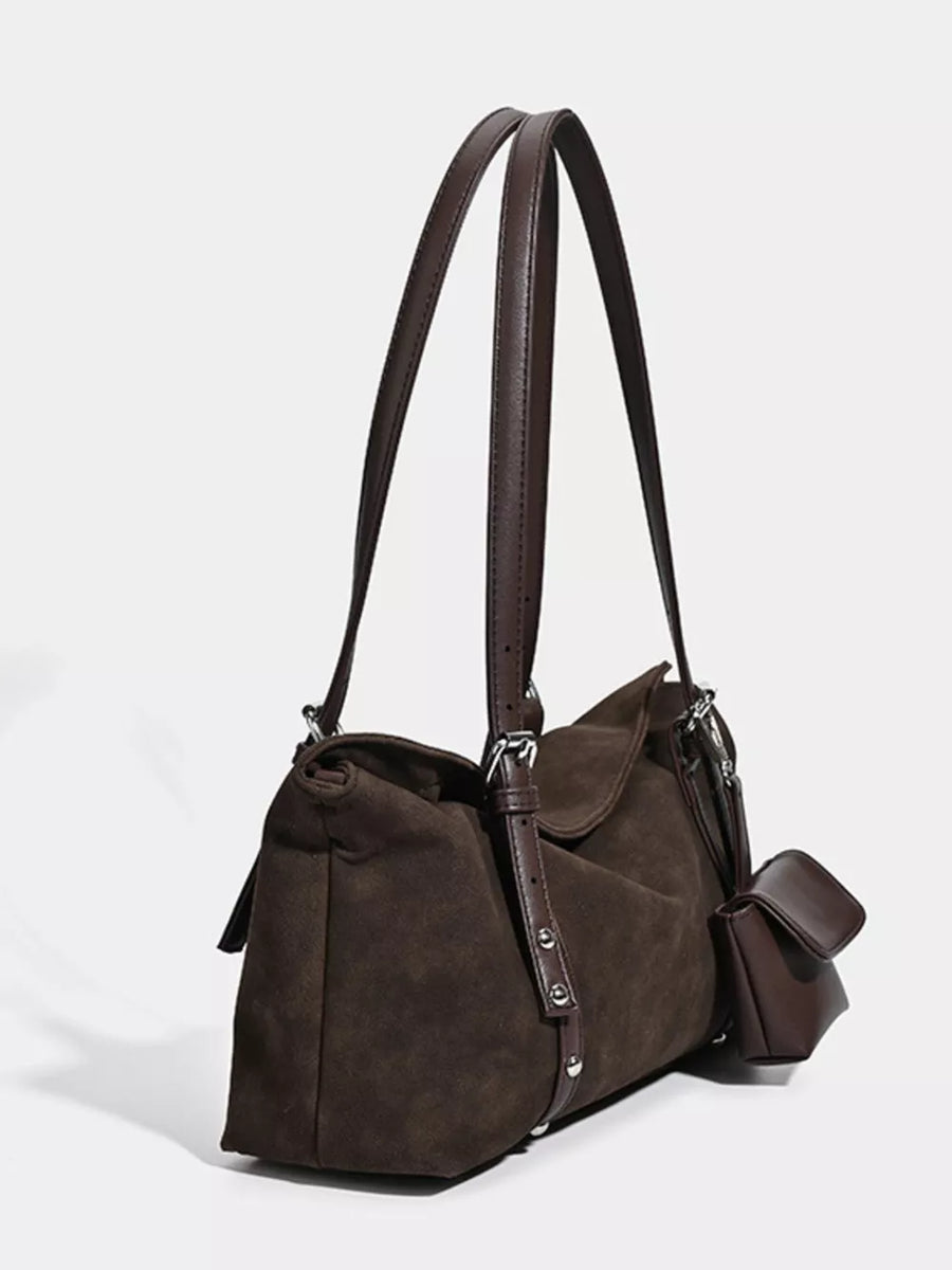 Brown suede medium shoulder bag with adjustable straps and a small attached pouch.