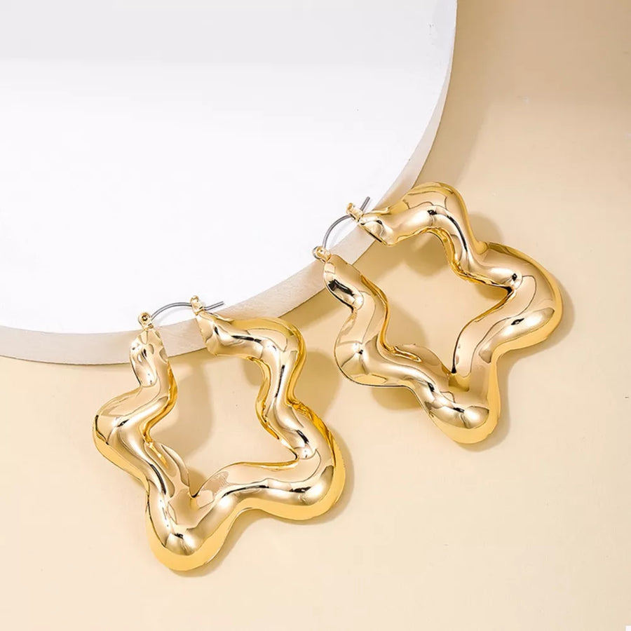 earrings in gold featuring star-shaped and hoop fit