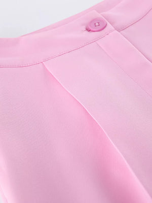 95% polyester, 5% spandex Care instructions: Machine wash cold two-piece set in Pink with fitted top, wide-leg bottom