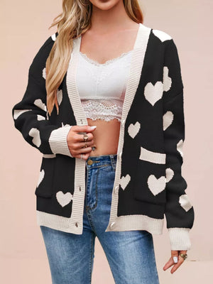 cardigan featuring heart-print in light pink with 100% Acrylic Care instructions: Machine wash cold texture