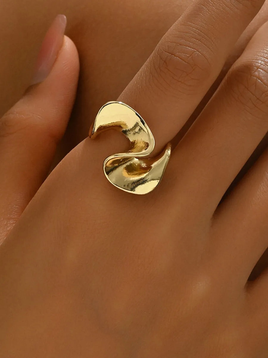 Gold ring featuring open-ended and geometric