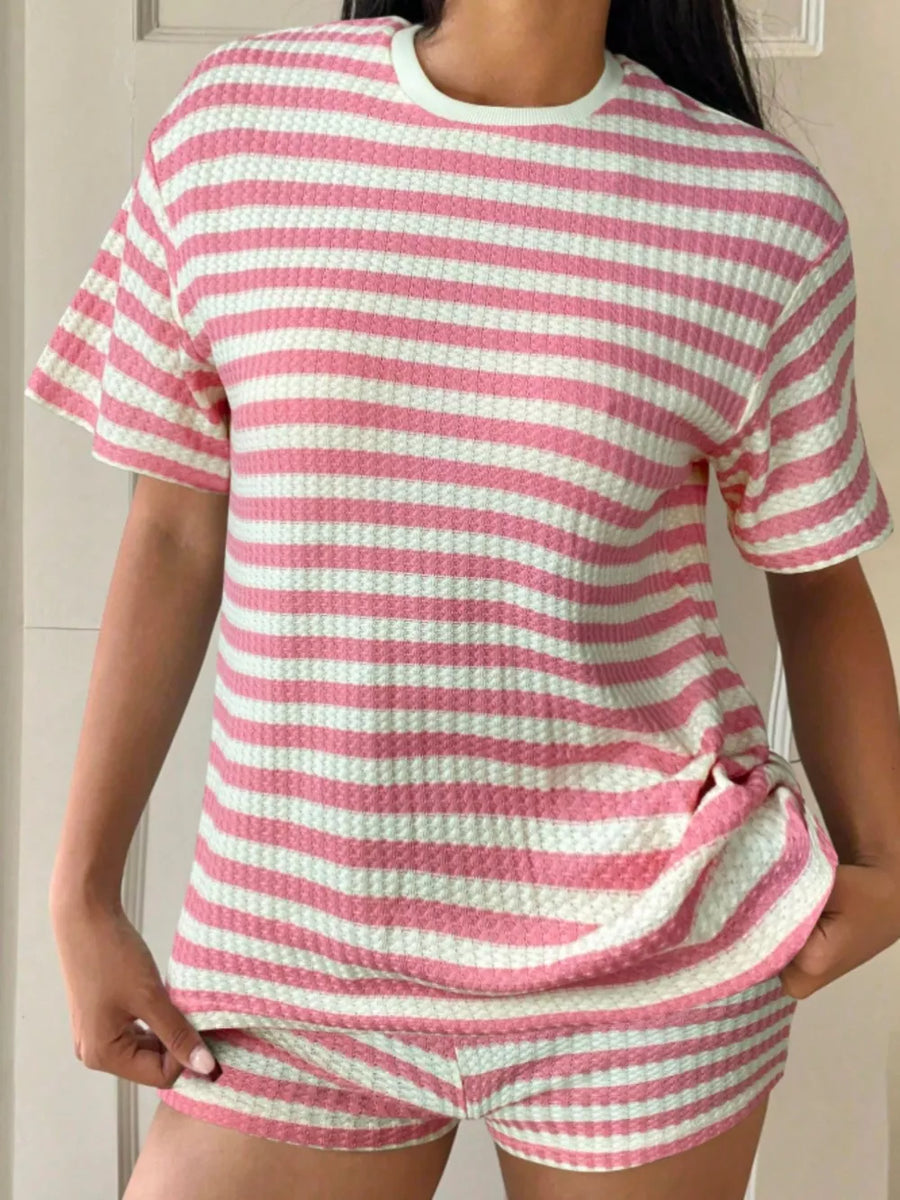 Pink and white striped waffle knit loungewear set with crew neck top and shorts.