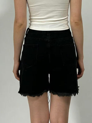 Black denim shorts with frayed hem and high rise