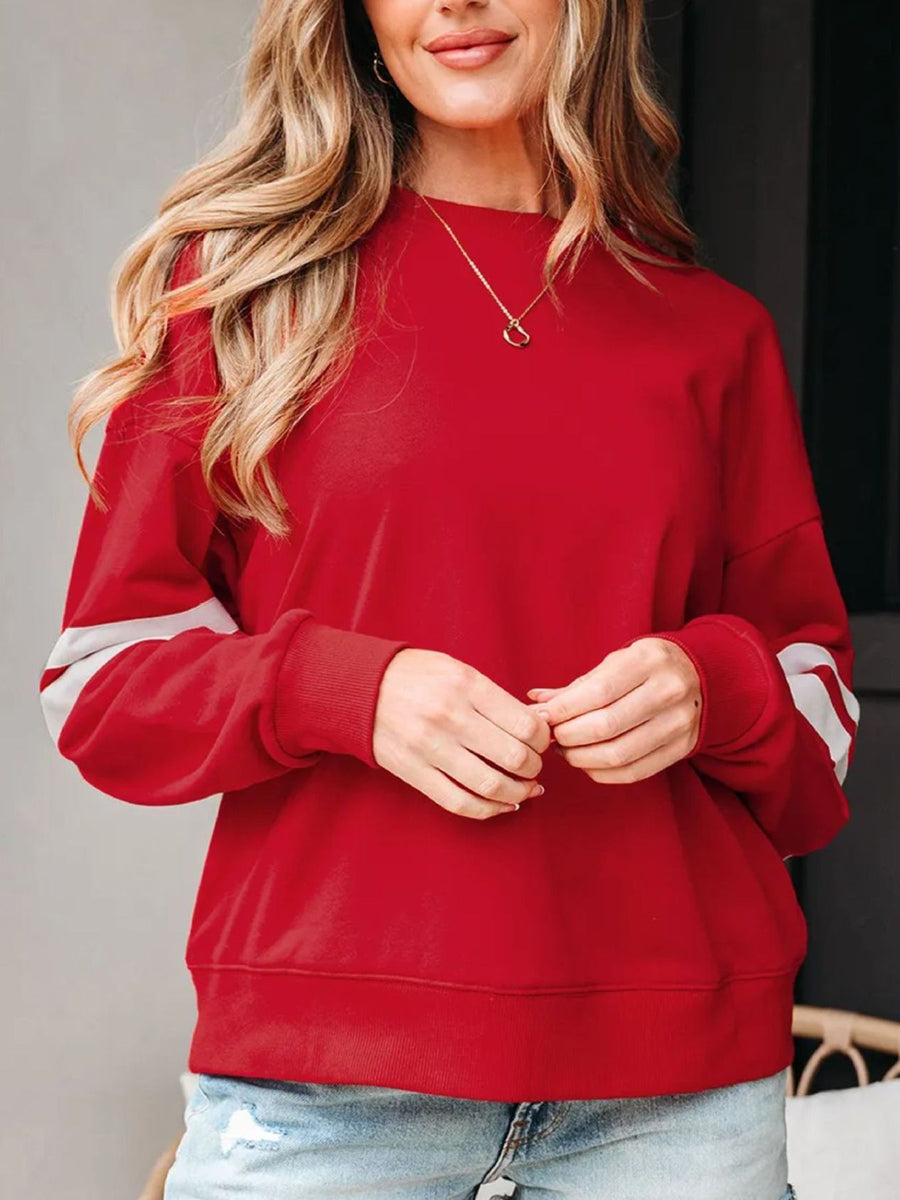 white sweatshirt featuring dropped shoulder and striped