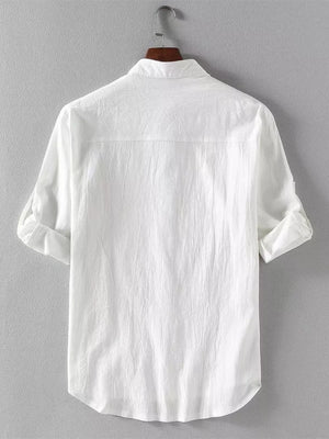 White casual button-up shirt with band collar and rolled sleeves.