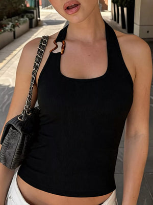 Black ribbed halter tank top with scoop neck and decorative tortoise ring detail.