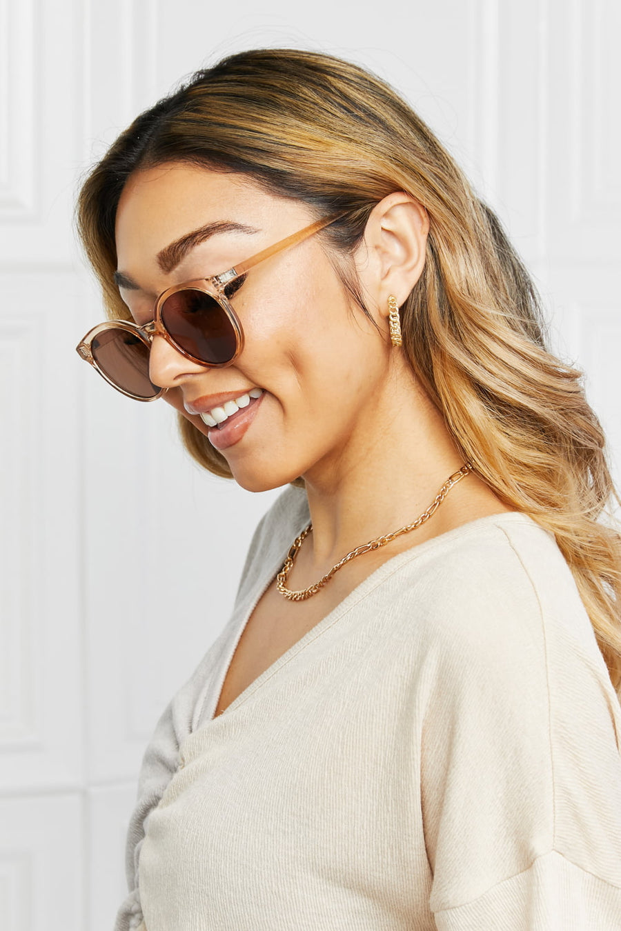 Tortoiseshell round frame sunglasses with tan acetate frames and brown lenses.
