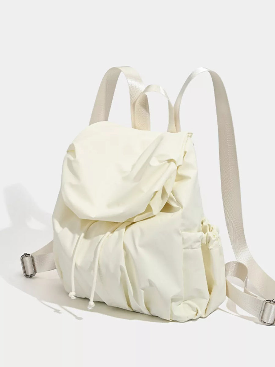 Cream nylon drawstring backpack with flap closure and side pockets