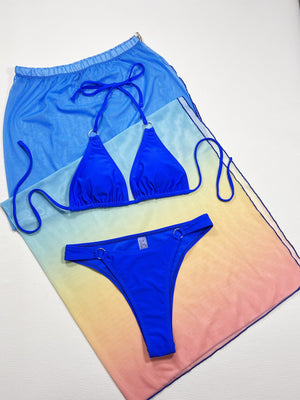Royal blue bikini set with a mesh ombre sarong cover-up featuring a drawstring waist.