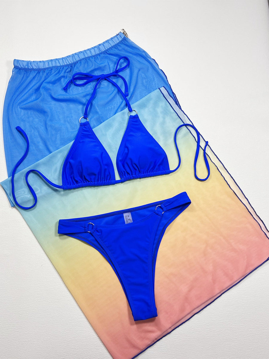 Royal blue bikini set with a mesh ombre sarong cover-up featuring a drawstring waist.