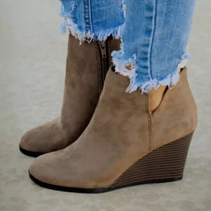 Khaki suede wedge ankle boots with side zipper and distressed denim cuffs.
