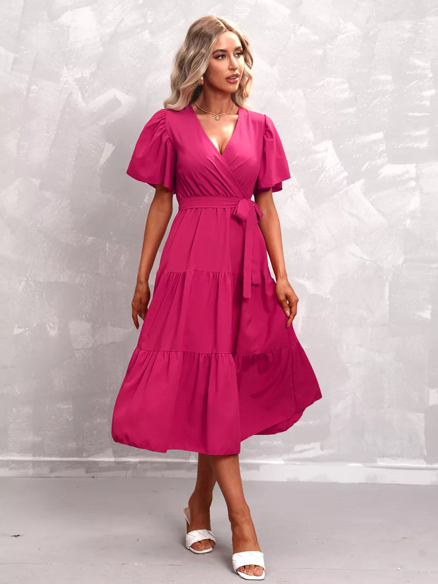 Hot Pink tiered midi dress with flutter sleeves and a belted waist.