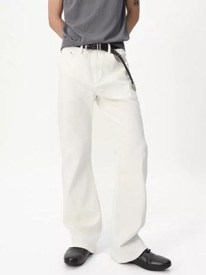 Relaxed fit white bootcut jeans for men with a braided black belt.