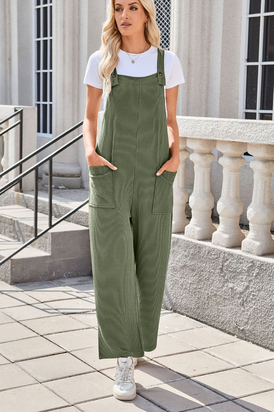 Moss green striped denim overalls with patch pockets and wide legs.