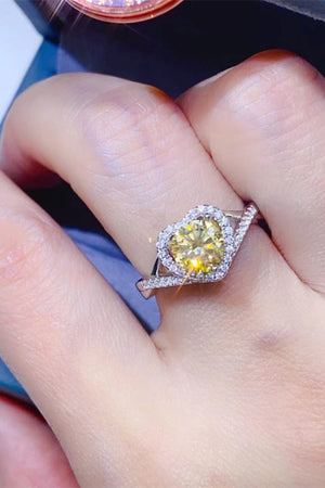 Yellow heart halo moissanite ring in silver with pave band.