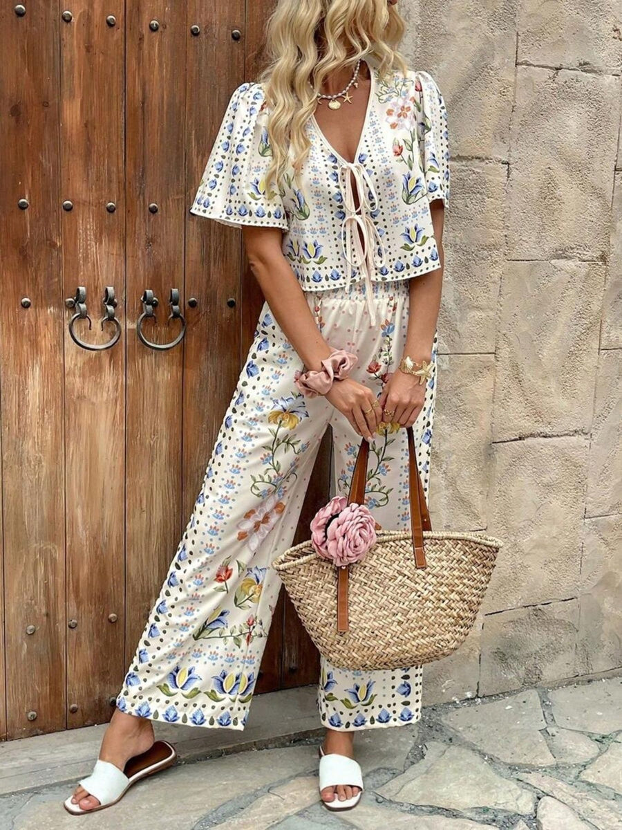 Floral tie-front cropped top and wide-leg pants set with blue and yellow botanical print.