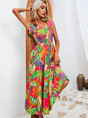 Tropical tie-strap smocked midi dress in pink with green leaf print, tiered skirt