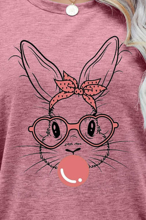 Dusty Pink t-shirt with a graphic bunny wearing glasses and a polka dot bow, blowing a bubble.