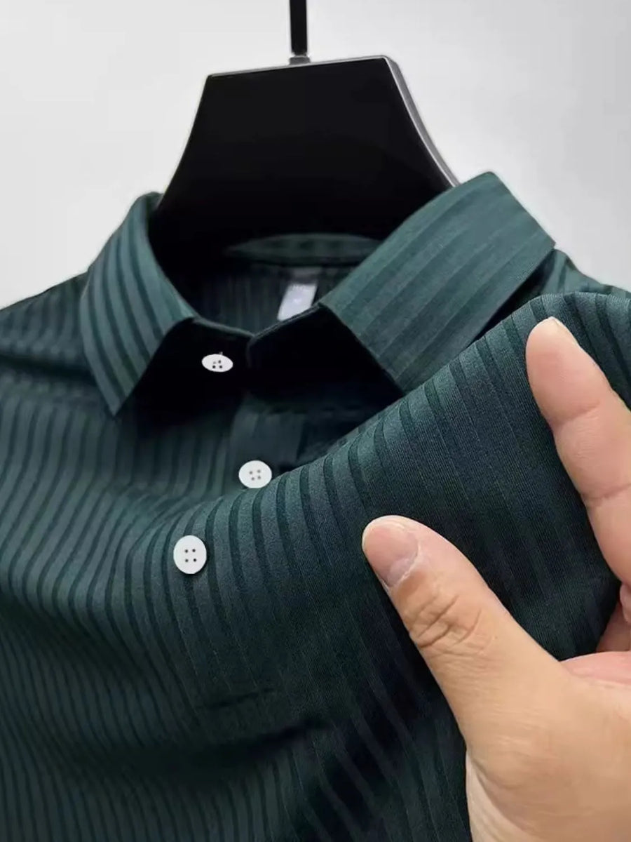 Textured ribbed polo shirt in Black Forest with buttoned collar and cuffs.