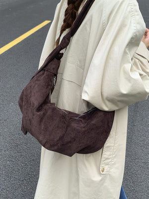 Knotted Strap Crescent Crossbody Bag in black with knotted strap