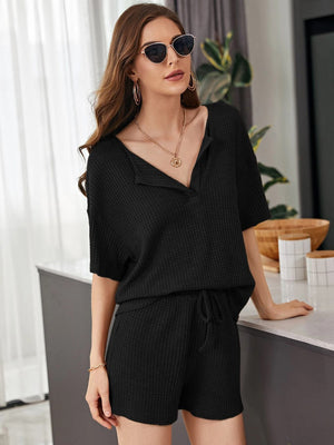 Black waffle knit henley short set with drawstring shorts and short sleeves.