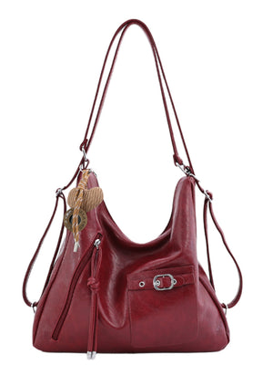 PU Leather Crossbody Bag With Heart Charm in Black with adjustable strap