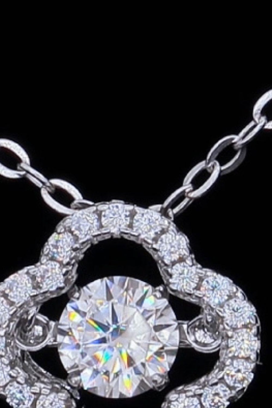 Silver pendant necklace with clover cut moissanite and diamond accents