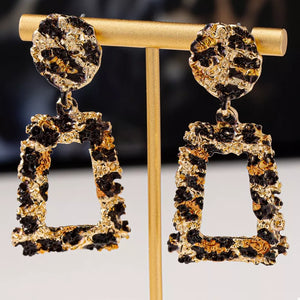 earrings in black with leopard and dangle