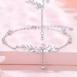 clear bracelet featuring leaf motif and floral