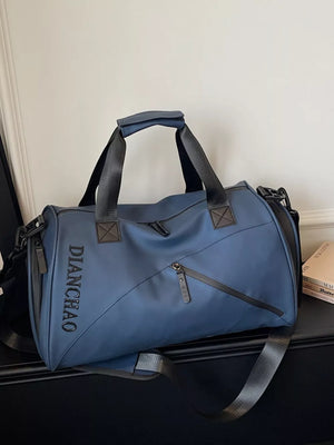 Blue travel organizer bag with padded strap and zippered pockets.