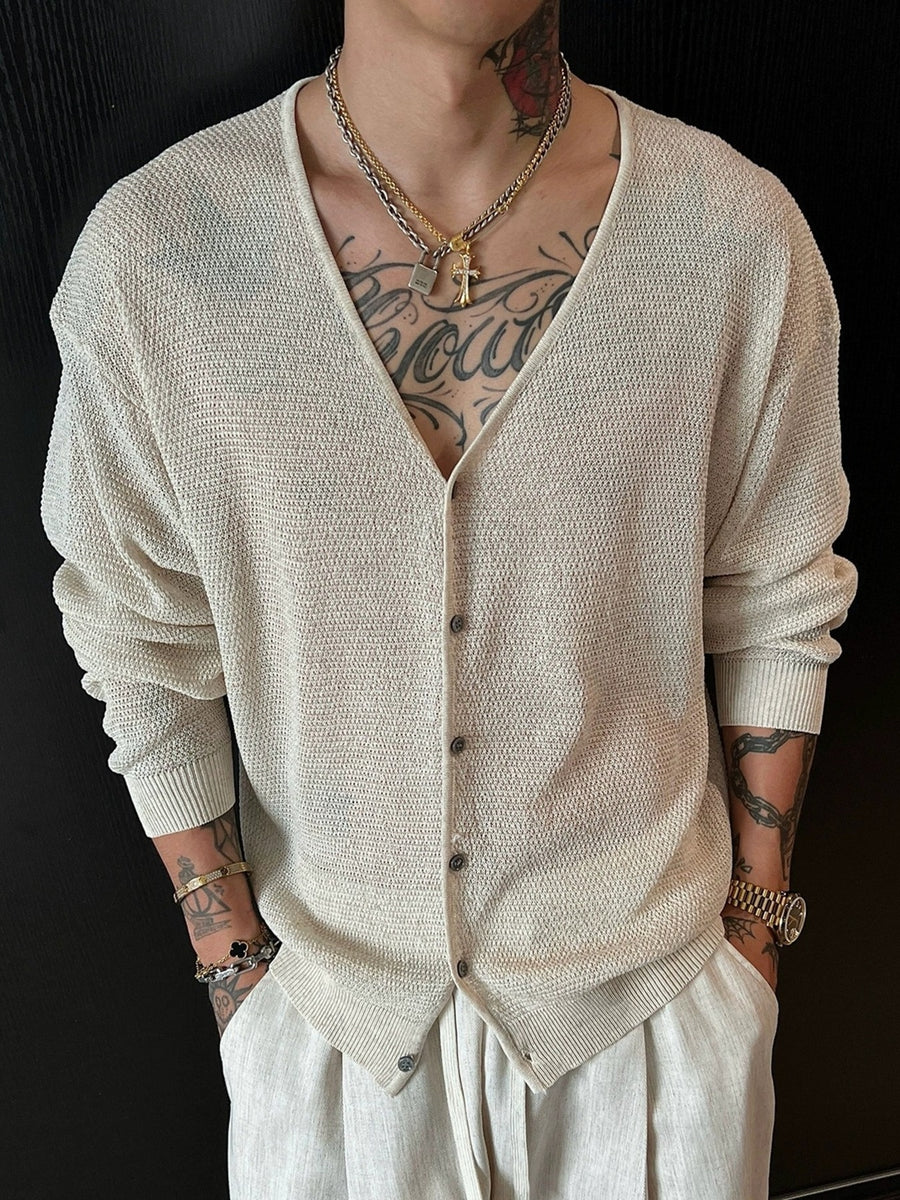100% Polyester Care instructions: Machine wash cold cardigan in ivory with relaxed silhouette